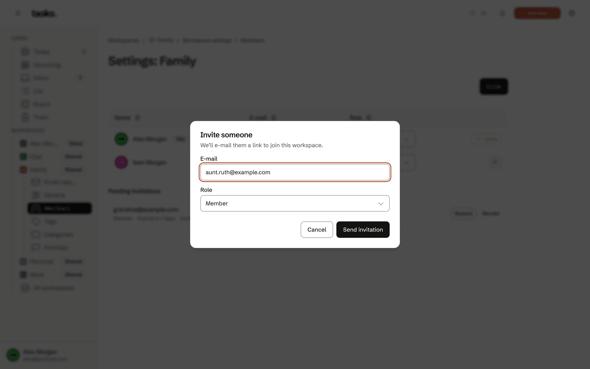 The family workspace's members with a pending invitation and the dialog that invites one more person by email.