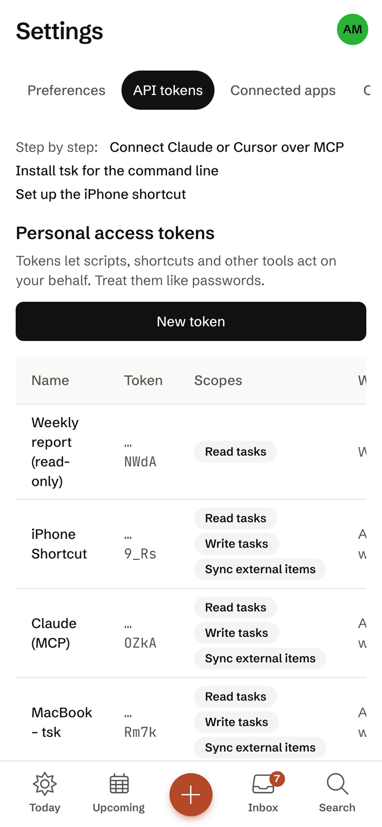 The API tokens page on the iPhone; only the last four characters of each token show.